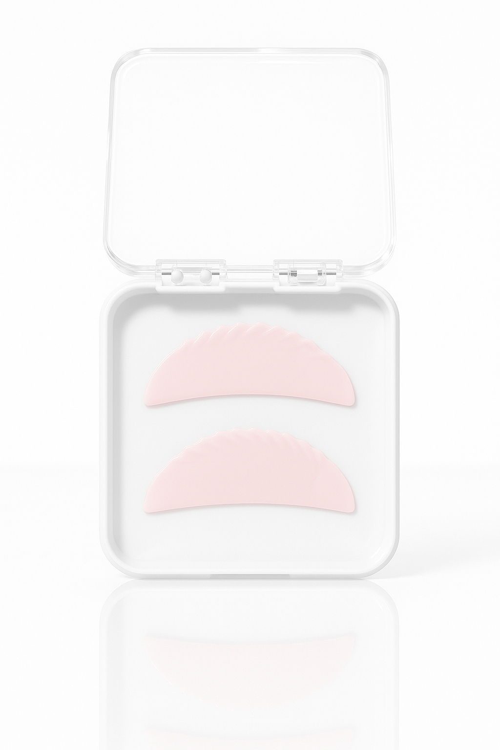 Pink eye patches in a clear plastic case on a white background